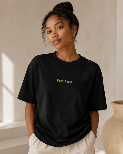 Pray First black Christian T-shirt worn by a Black female model